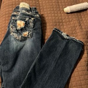 Miss Me jeans cow print 32 boot.the cow print on the pocket is falling off.